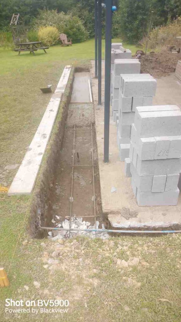 concreting footings with steel reinforcement and over stepping drain