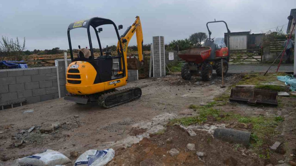 digger excavating driveway