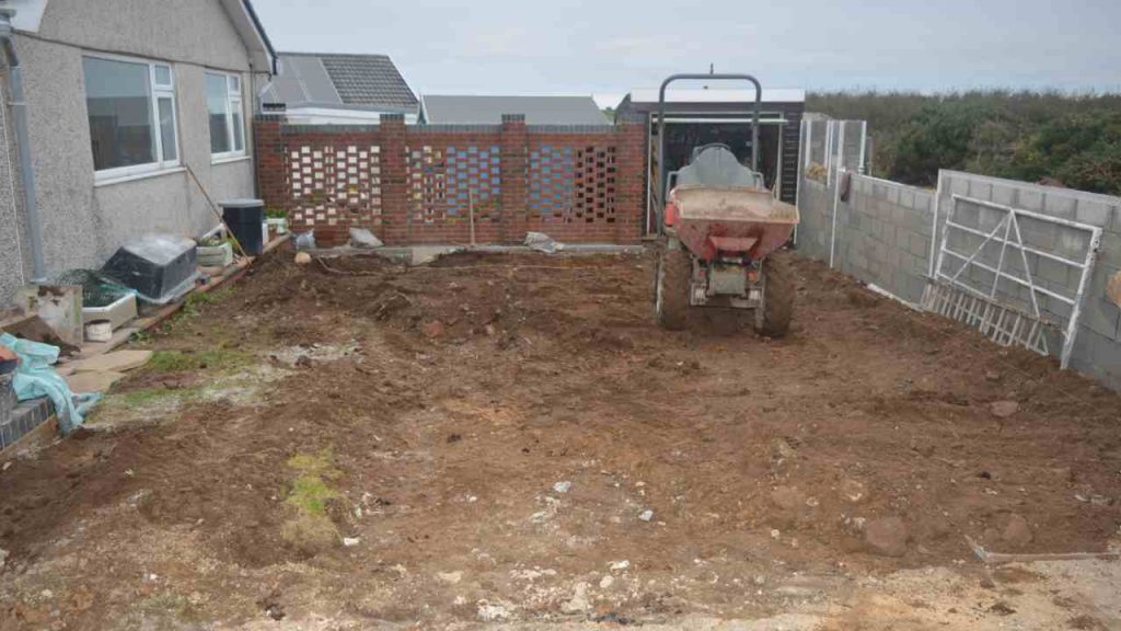 digger excavating driveway