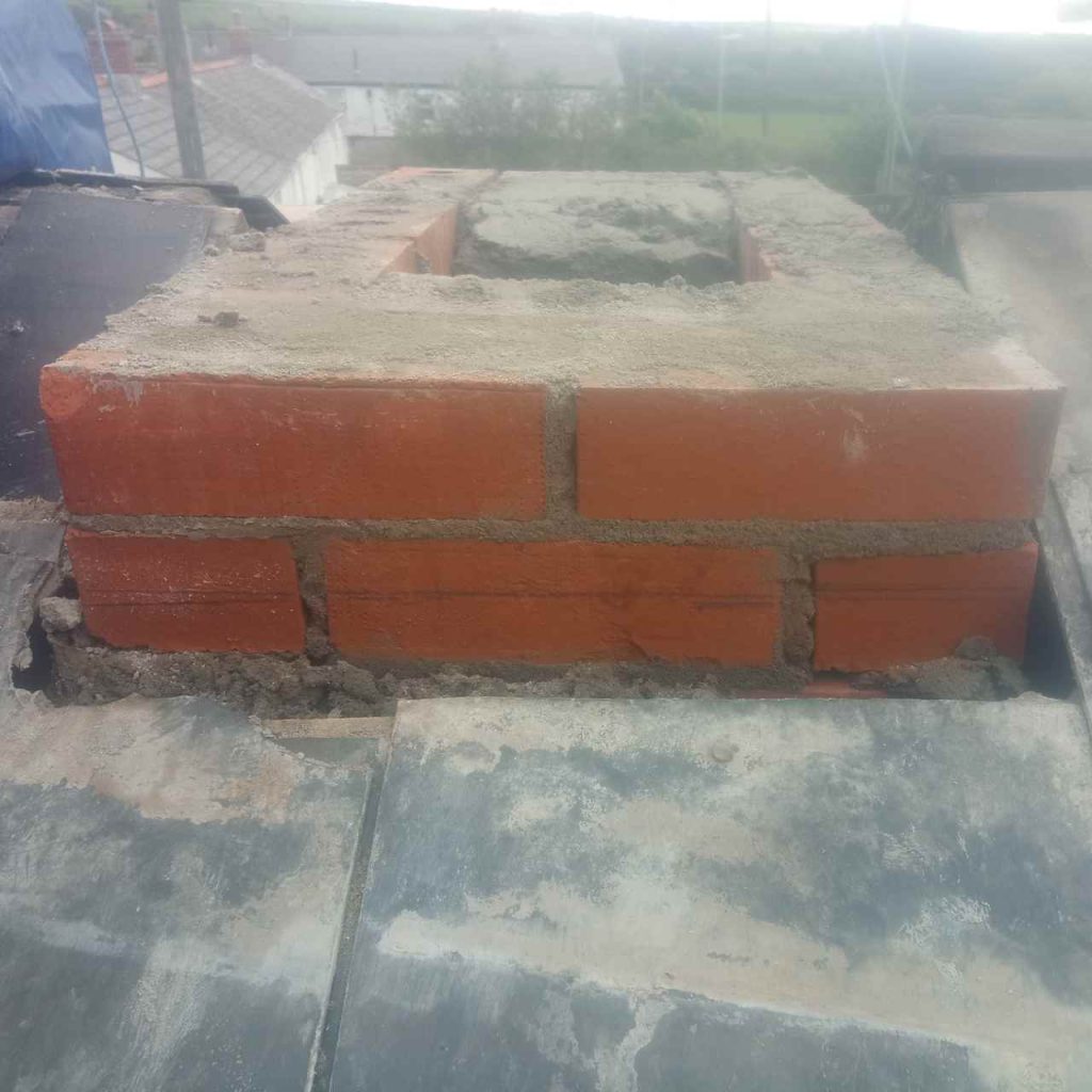 first three courses of new brick work to stack