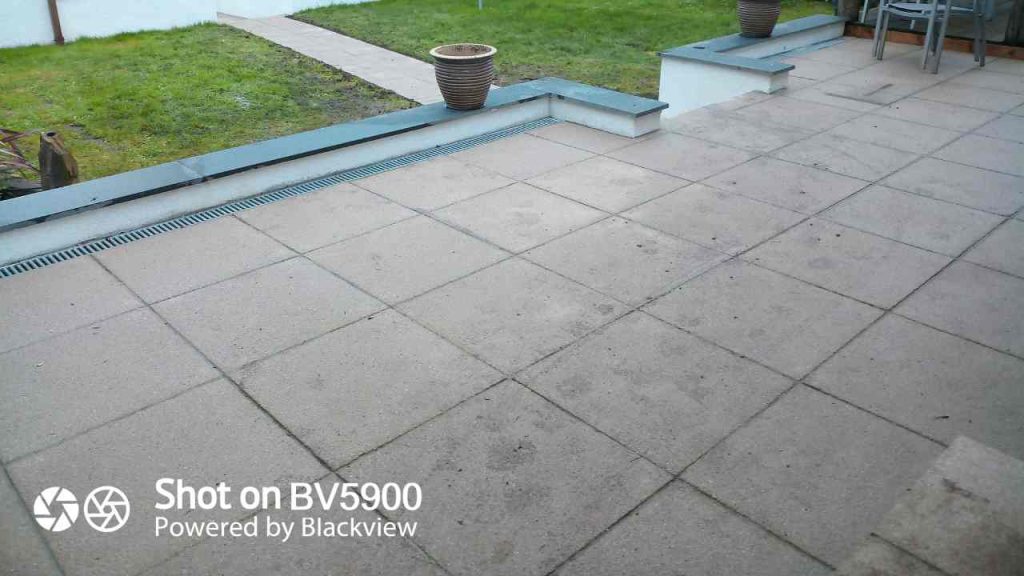 Finished patio of Saxon paving with aco drains