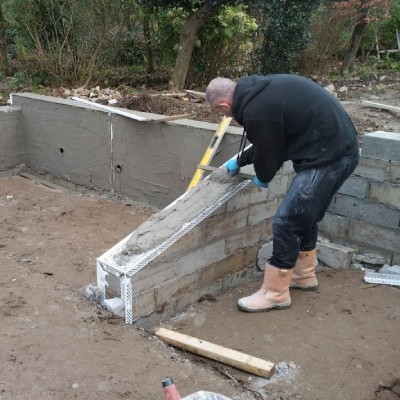 workman cement rendering a masonry wall